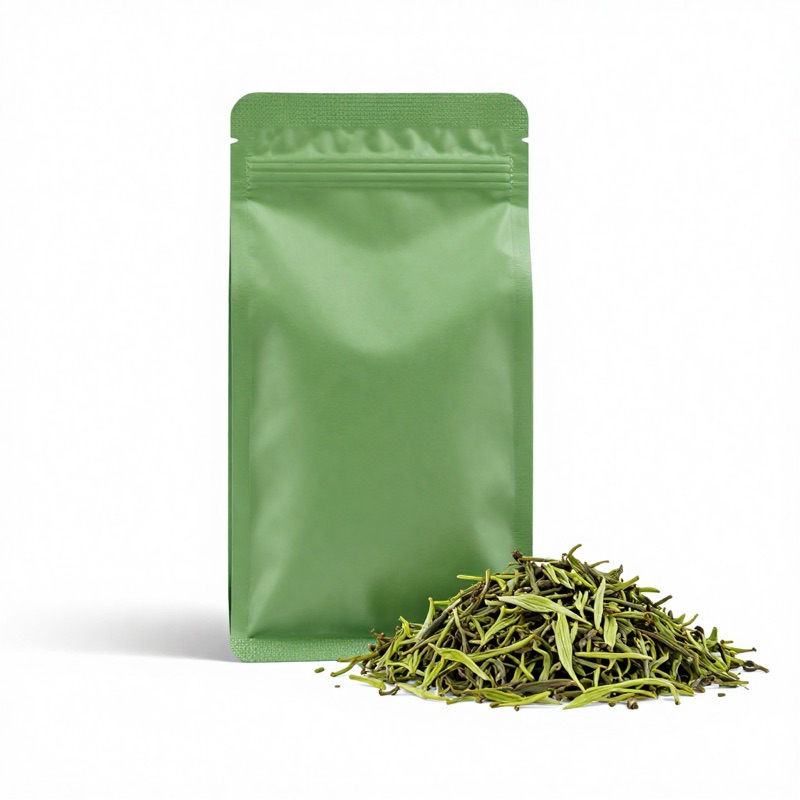 Green tea private-label pouch on loose green tea